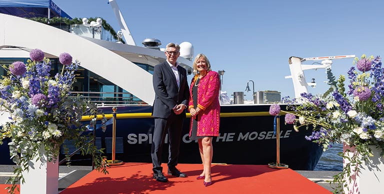 Nigel Blanks, CEO of Saga Cruises and Louise Robinson, Saga Magazine Editorial Director and Godmother to Spirit of the Moselle standing in front of the ship